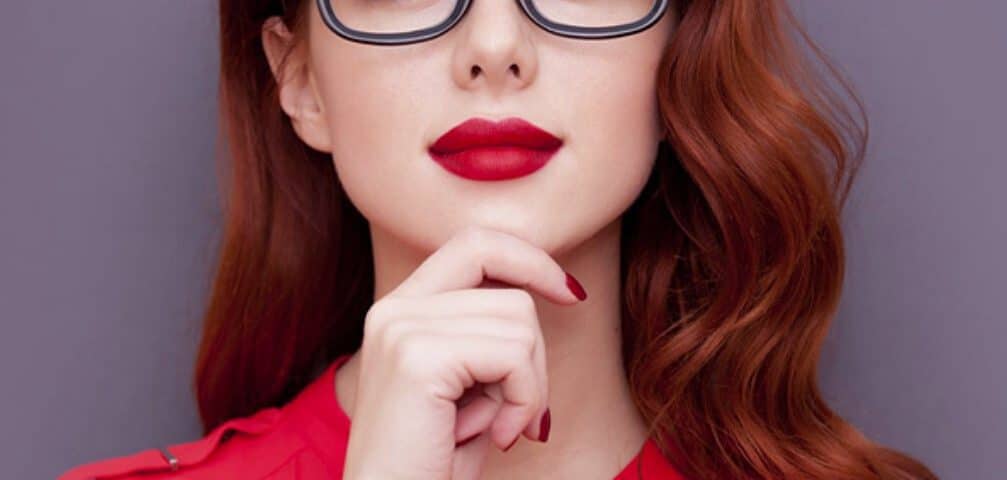 A silent working woman is posing for the picture while also looking stunning.