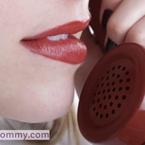 She is conversing with someone while also answering the phone in "Become a Phone Sex Operator."