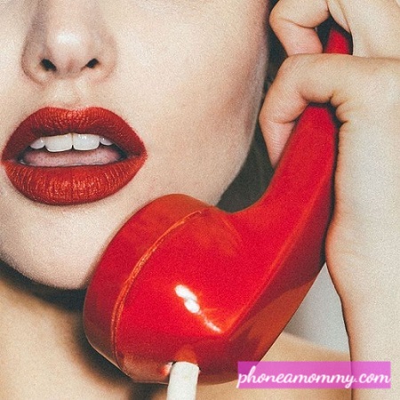 While talking on the phone and applying red lipstick for the photo session, a telephone operator