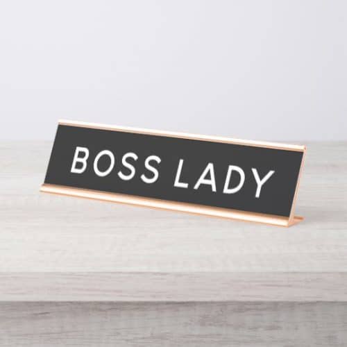 The image and board in the image both refer to a boss lady.