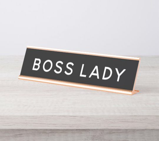The image and board in the image both refer to a boss lady.